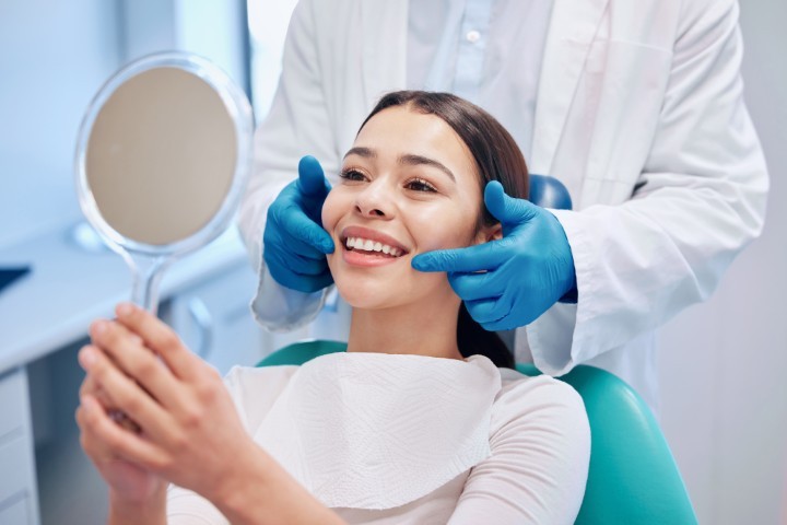 Patient reviewing cosmetic dentistry smile results at Precious Smiles Family Dentistry