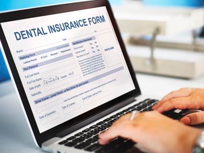 Patient reviewing dental insurance and financing information online